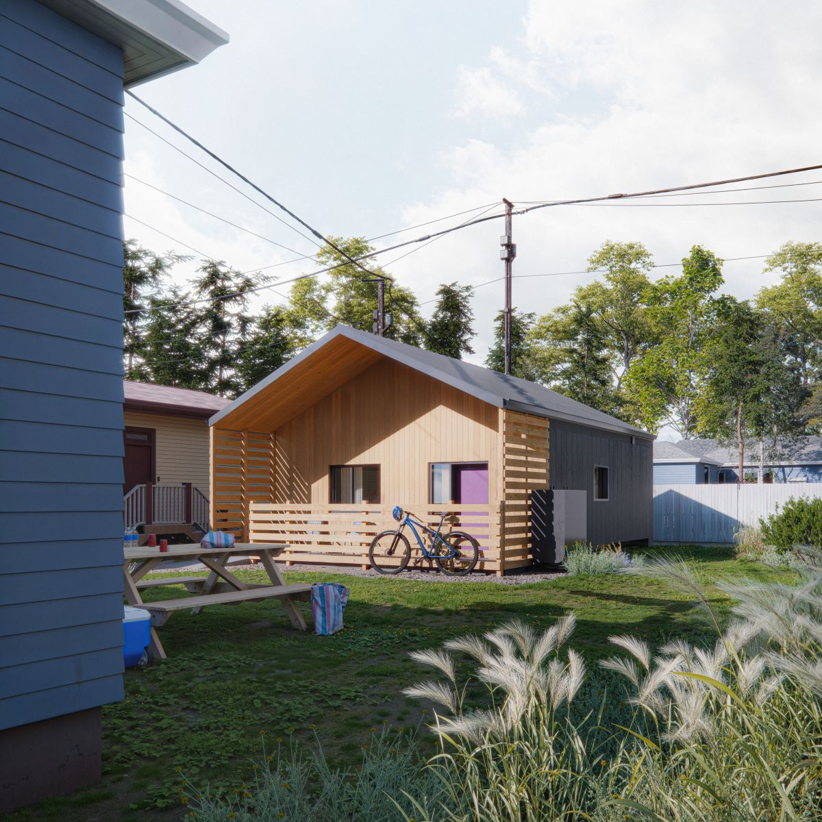 Rendu 3D d’une maison de plain-pied dotée d’un toit à pignon et d’une façade en bois naturel et en métal foncé. L'immeuble présente un porche partiellement fermé par des garde-corps à lattes horizontales. La maison est entourée de bâtiments voisins, de lignes électriques et de verdure. Un sentier de gravier mène à l’entrée.